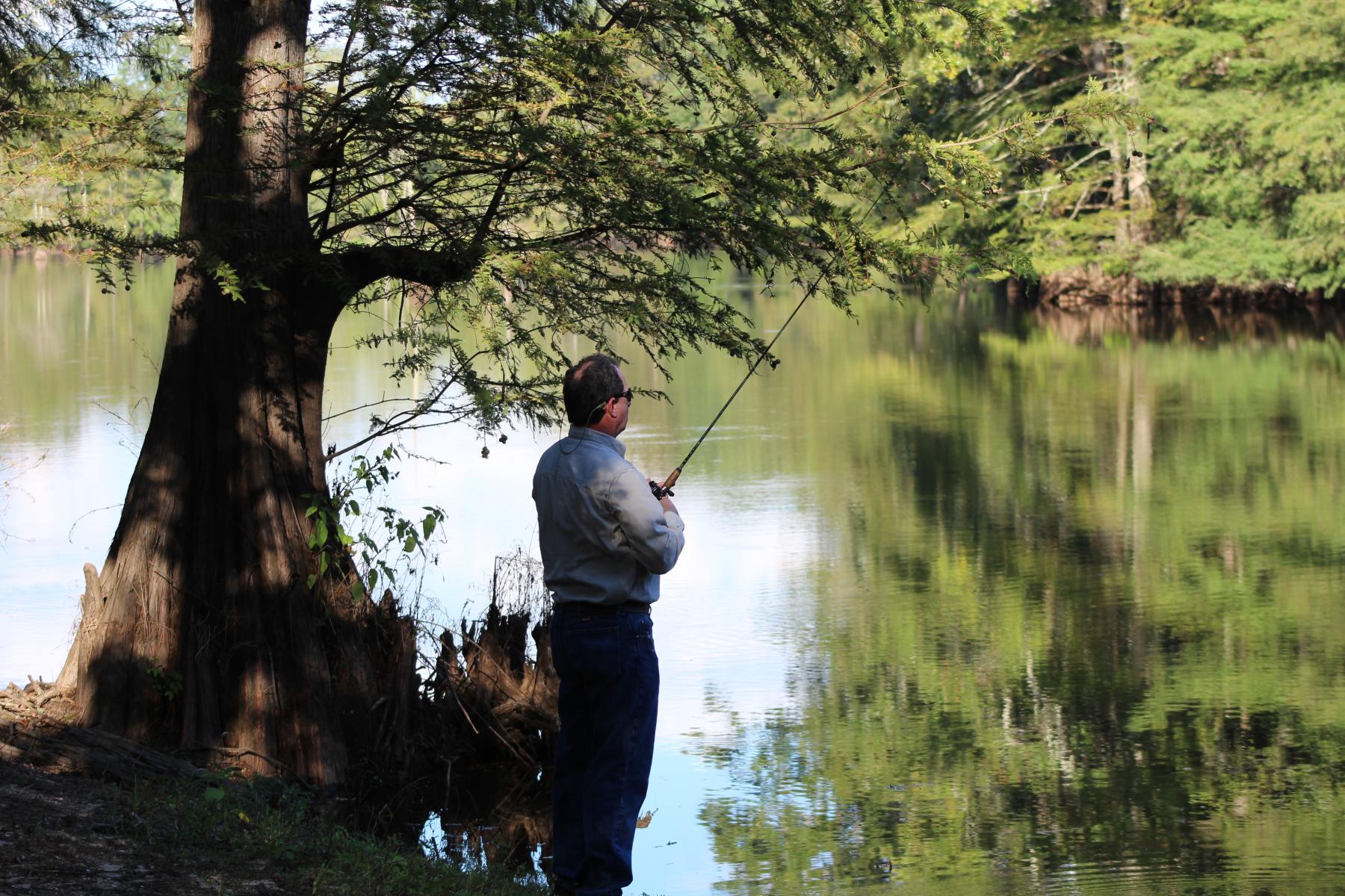 Man fishing at Chemin-A-Haut